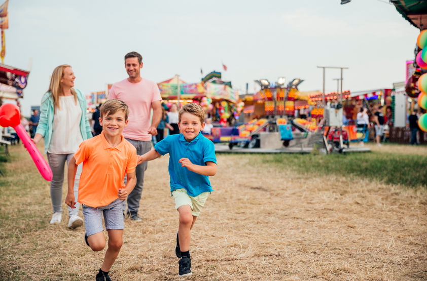 Family enjoying attractions at The Rock Show showgrounds